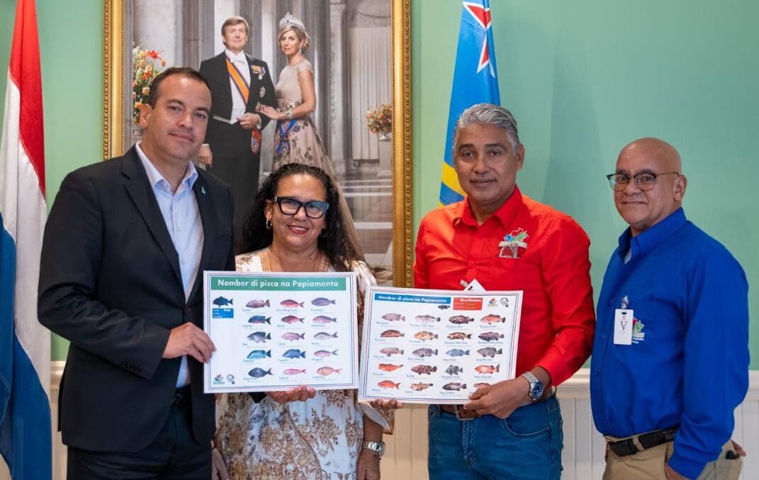 Santa Rosa Presents Papiamento Fish Name Poster to Minister Wever