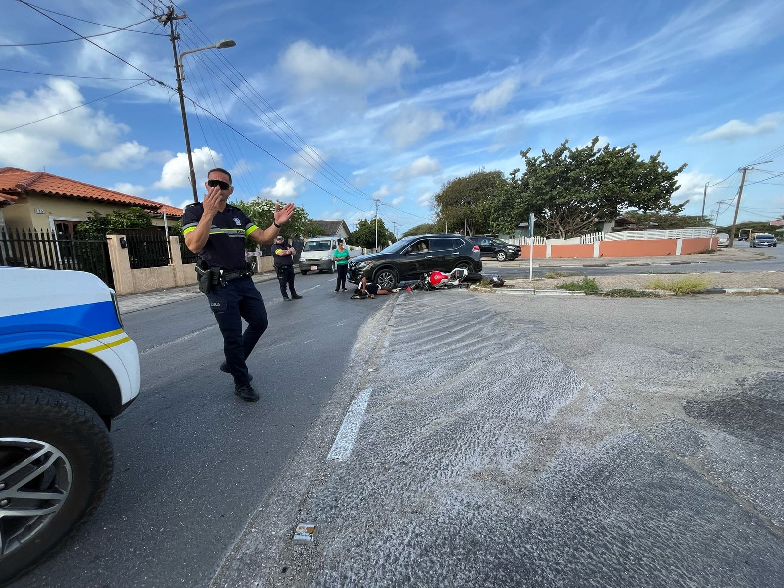Motorcycle trapped under car after collision | English - 24ora