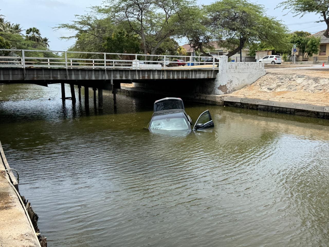 No injuries after car plunges into water following collision | English ...